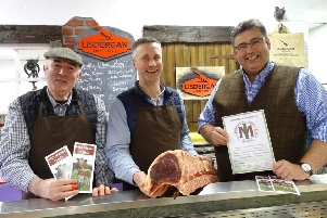 Brian O'Kane, IMCS chairperson, presents Irish Moiled Certificate to ian McKernaghan of Lisdergan Butchery, Fintona