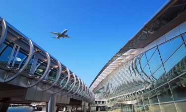 Plane flying over Incheon International Airport terminal