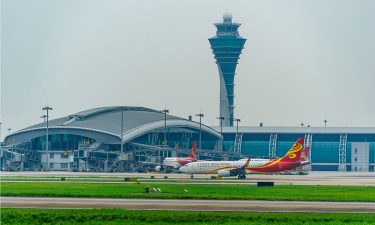 Plane waiting on runway at Guangzhou Baiyun International Airport