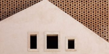 António Costa Lima inserts brick home into an old Lisbon warehouse
