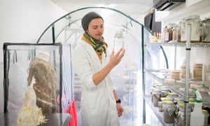 Ashley Granter, lead mycologist, holds a liquid suspension of mycelium in the Biohm research lab in Shepherds Bush, west London.