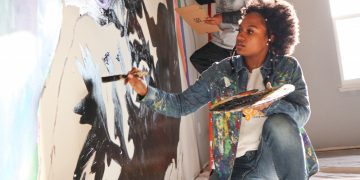 Wilmington’s Youth contributes to Teen Warehouse by painting a mural 