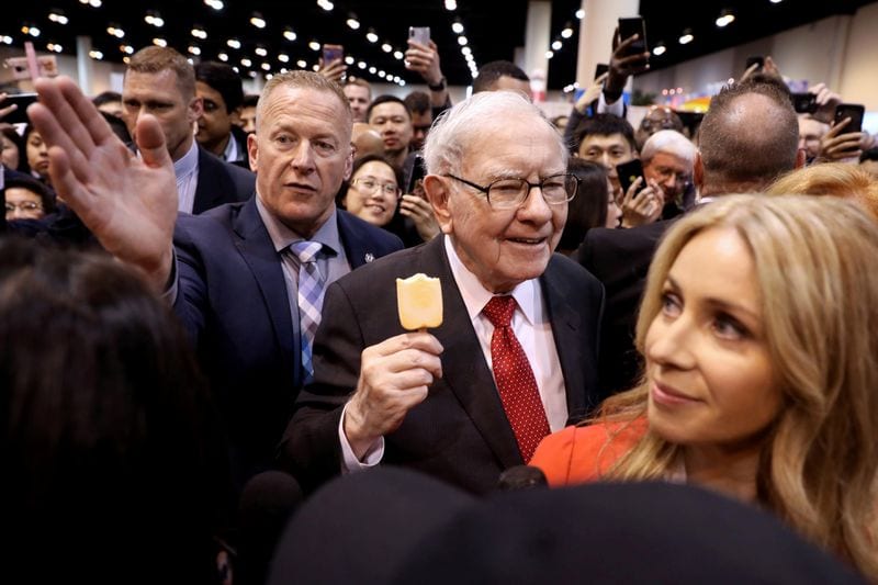 FILE PHOTO: Berkshire Hathaway Chairman Warren Buffett walks through the exhibit hall as shareholders gather to hear from the billionaire investor at Berkshire Hathaway Inc's annual shareholder meeting in Omaha