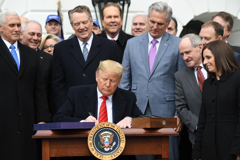 Trump signs USMCA. 
