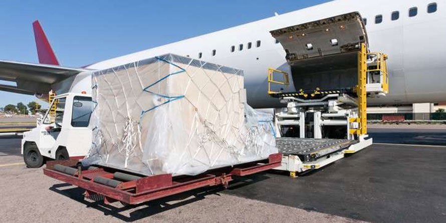 Goods are loaded onto a cargo plane