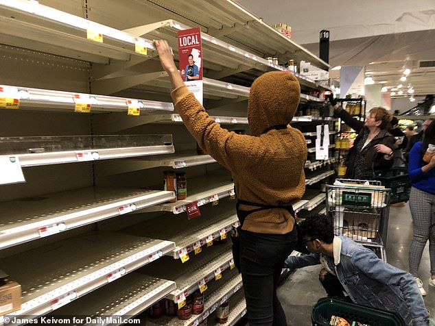 Empty shelves at Whole Foods Market at Union Square on Friday saw panicked New Yorkers rushing to stock up on essentials