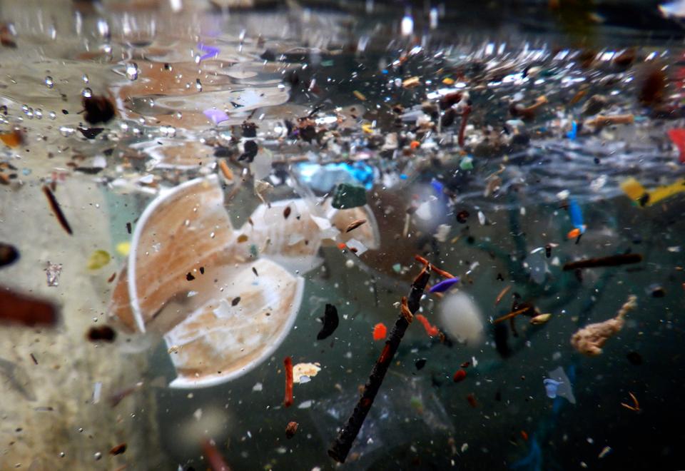 Plastic waste and debris underwater carried by the storm of...