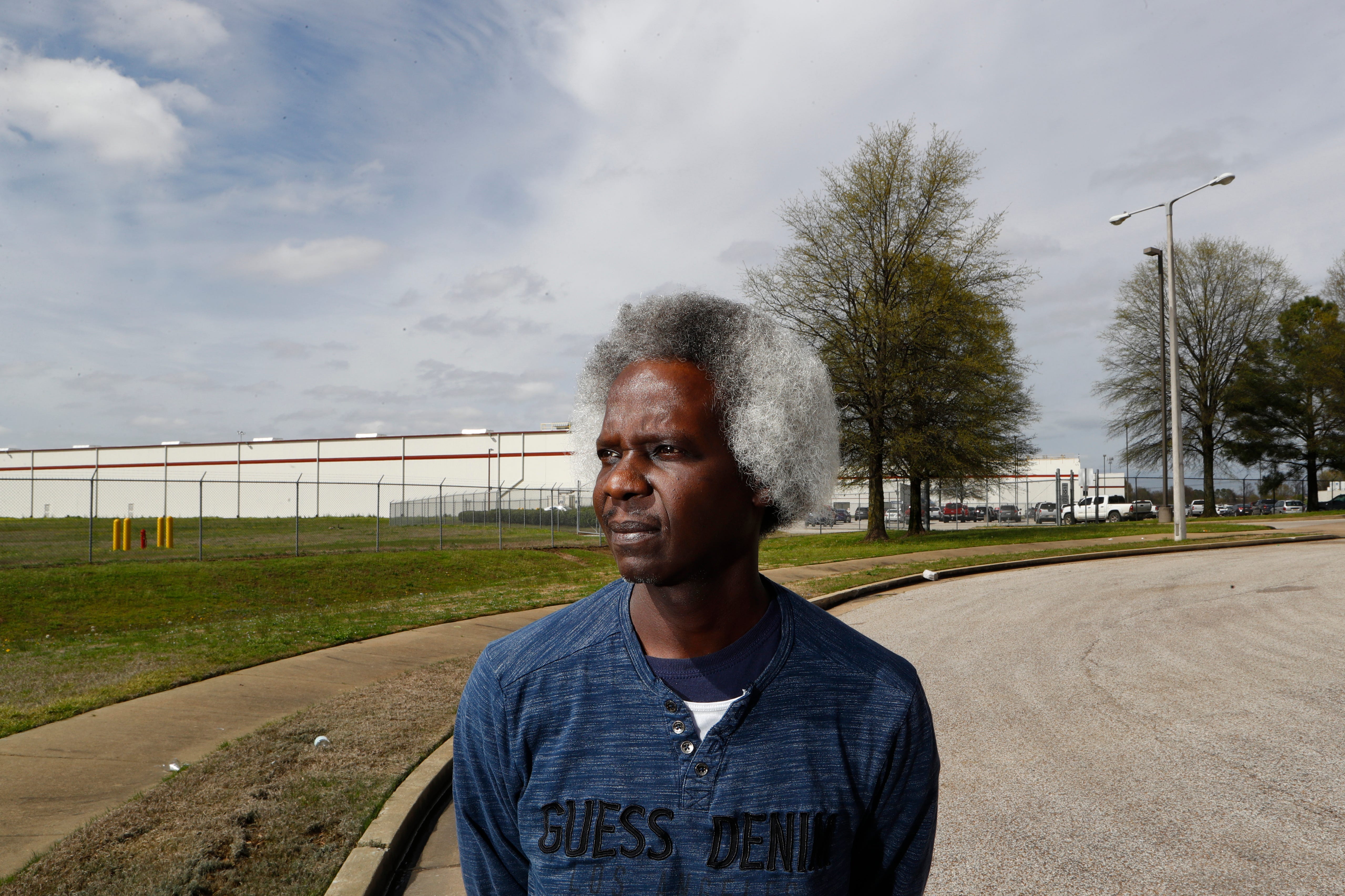 Aaron Washington stands outside of the Kroger supply warehouse after his shift, and where he has worked since 2003. He, along with other workers at the warehouse are on mandatory 7-day-work weeks, sometimes working 16 hours a day to meet the supply needs of Mid-South grocers as coronavirus concerns have led to panic shopping by customers, emptying the shelves of local stores. 
