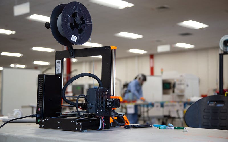 3-D printer being used by engineers from University of Lousville Speed School  for producing face shield for local health care professionals in response to the shortage caused by the COVID-19 pandemic.