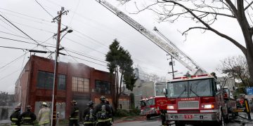 Two-alarm fire raging inside abandoned building