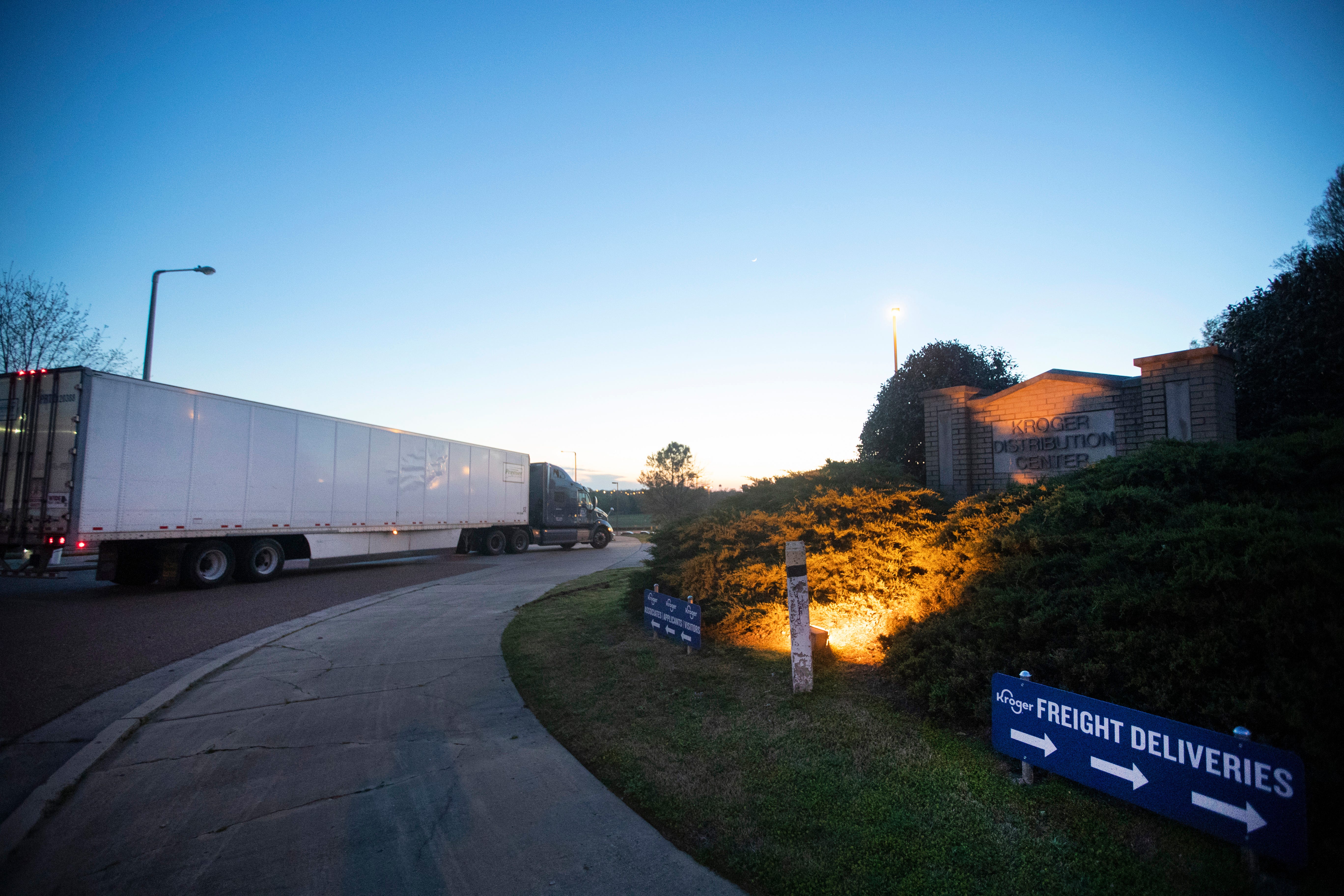 Semi-trucks line up outside of the Kroger warehouse after it became known that a worker tested positive for COVID-19, causing a work stoppage by concerned employees. 