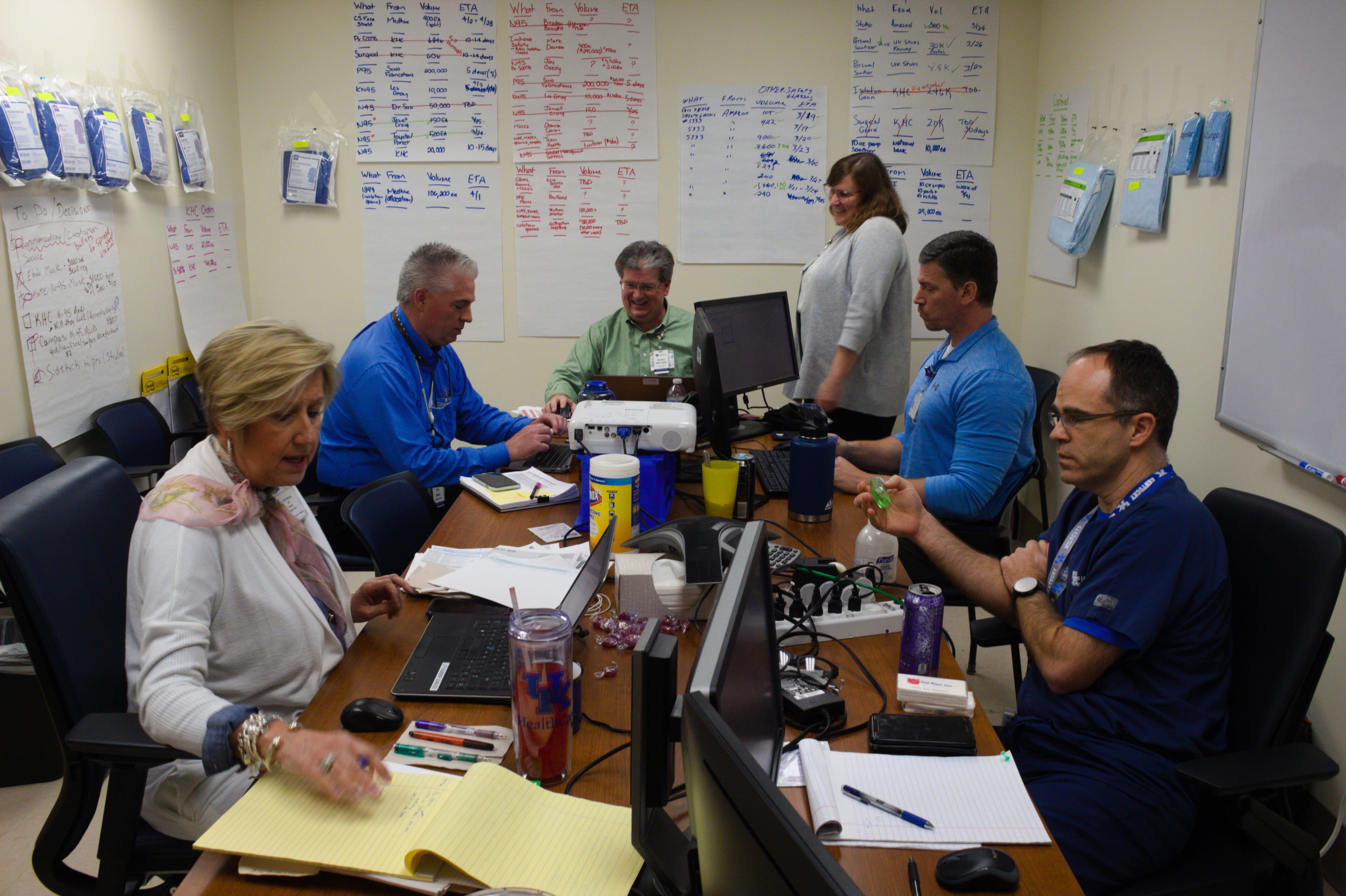 Members of the supply chain management team at the University of Kentucky hospital work in a "war room" trying to get more personal protective equipment amid the coronavirus outbreak.