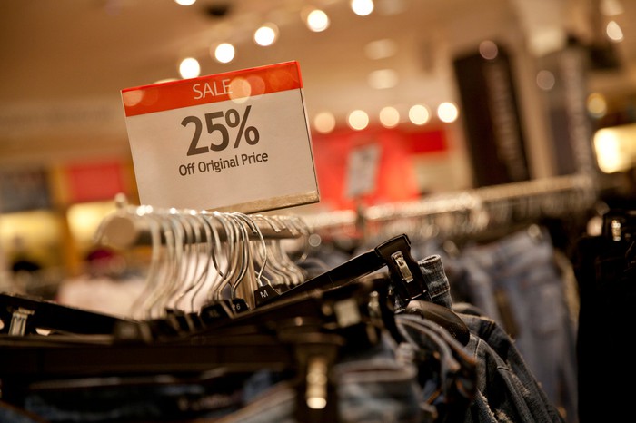 Discount jeans on a department store rack.