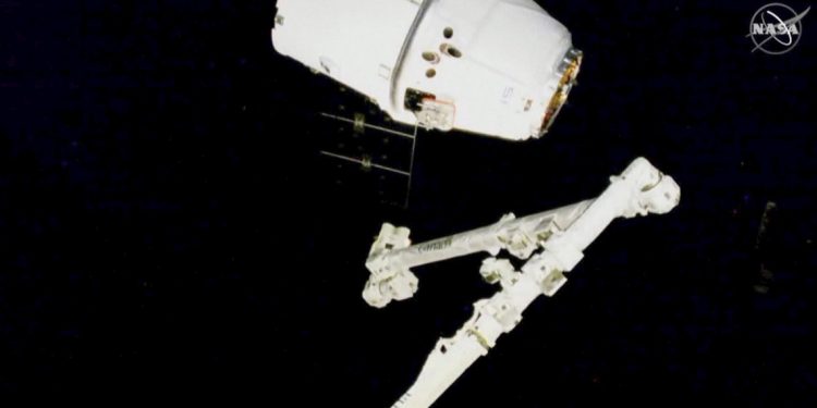 International Space Station Grabs SpaceX Cargo With Robotic Arm for the Final Time
