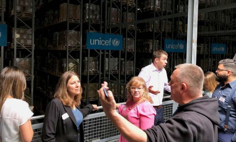 MBA students Sabrina Kramer and Michele Hansen listen as John Roger Nielsen, warehouse supervisor in UNICEF's supply division in Copenhagen, Denmark, explains how UNICEF works with government and company partners to strengthen supply chains for essential goods supporting child survival and development around the world. The students were on a June 2019 study-abroad program led by Associate Professor Barbara Hoopes exploring business operations and logistics in Finland, Sweden, and Denmark. Credit: Barbara Hoopes How the coronavirus has — and has not — disrupted the global supply chain