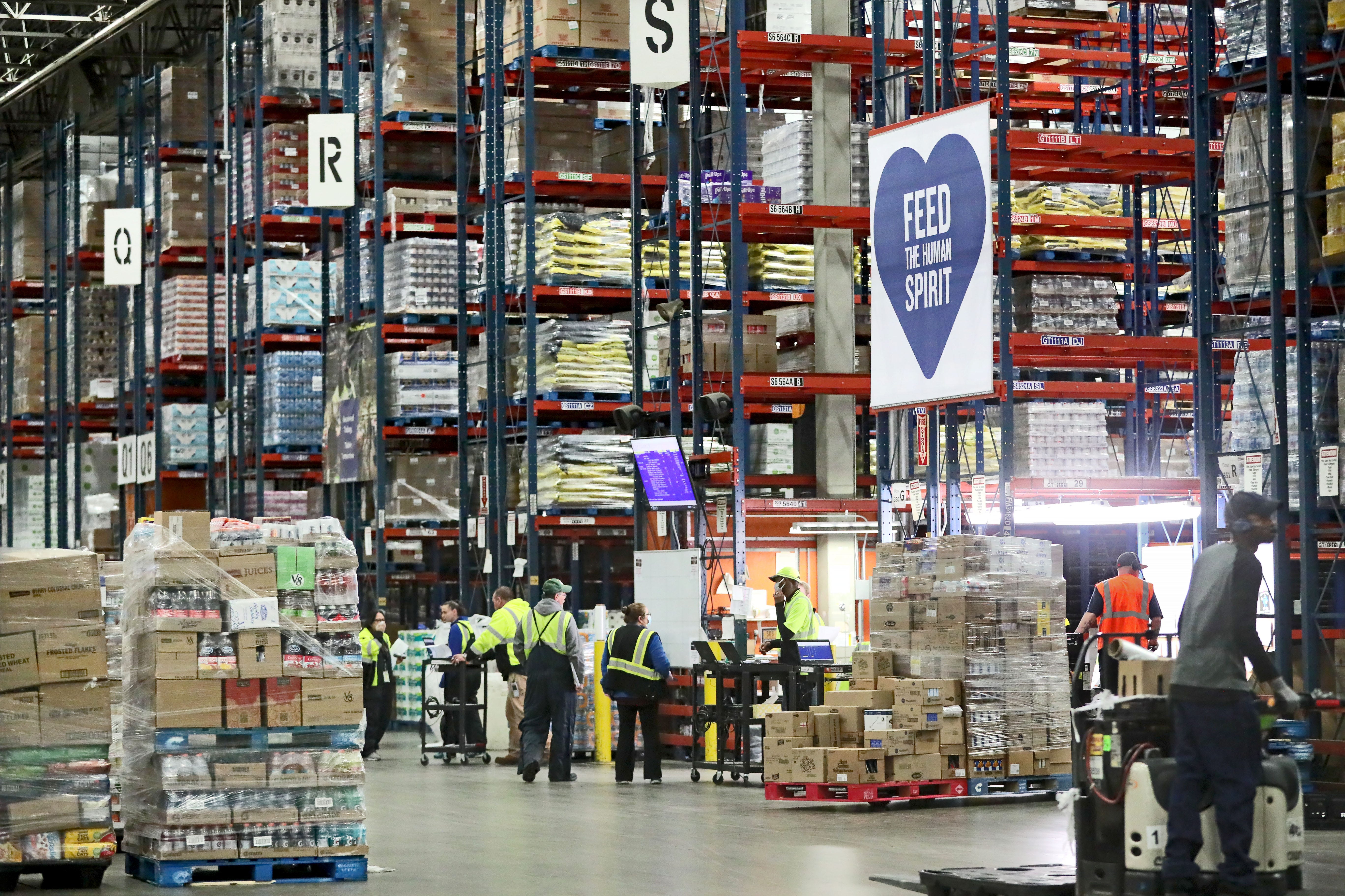 Team members meet and get assignments at the Roundy’s Supermarkets distribution center in Oconomowoc on Wednesday.
